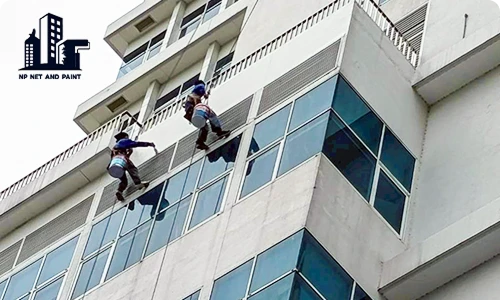 Clean the exterior walls of the building. npnetandpaint