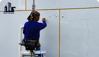 Rappelling to repair building walls npnetandpaint