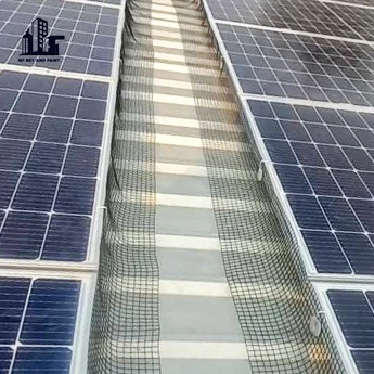 Install bird netting under the solar panels. npnetandpaint